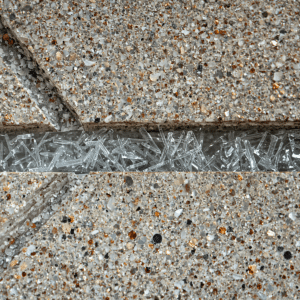 Cross-section of a GRC cladding panel showing alkali-resistant glass fibers in cement matrix - Dubai GRC manufacturer.