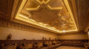 Arabic geometric GRG cornices and ceiling panels in a Dubai villa majlis with warm gold finish