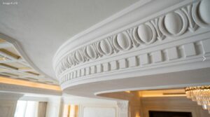 Close-up of classical egg-and-dart GRG cornices with dentil band in a formal Dubai villa ceiling